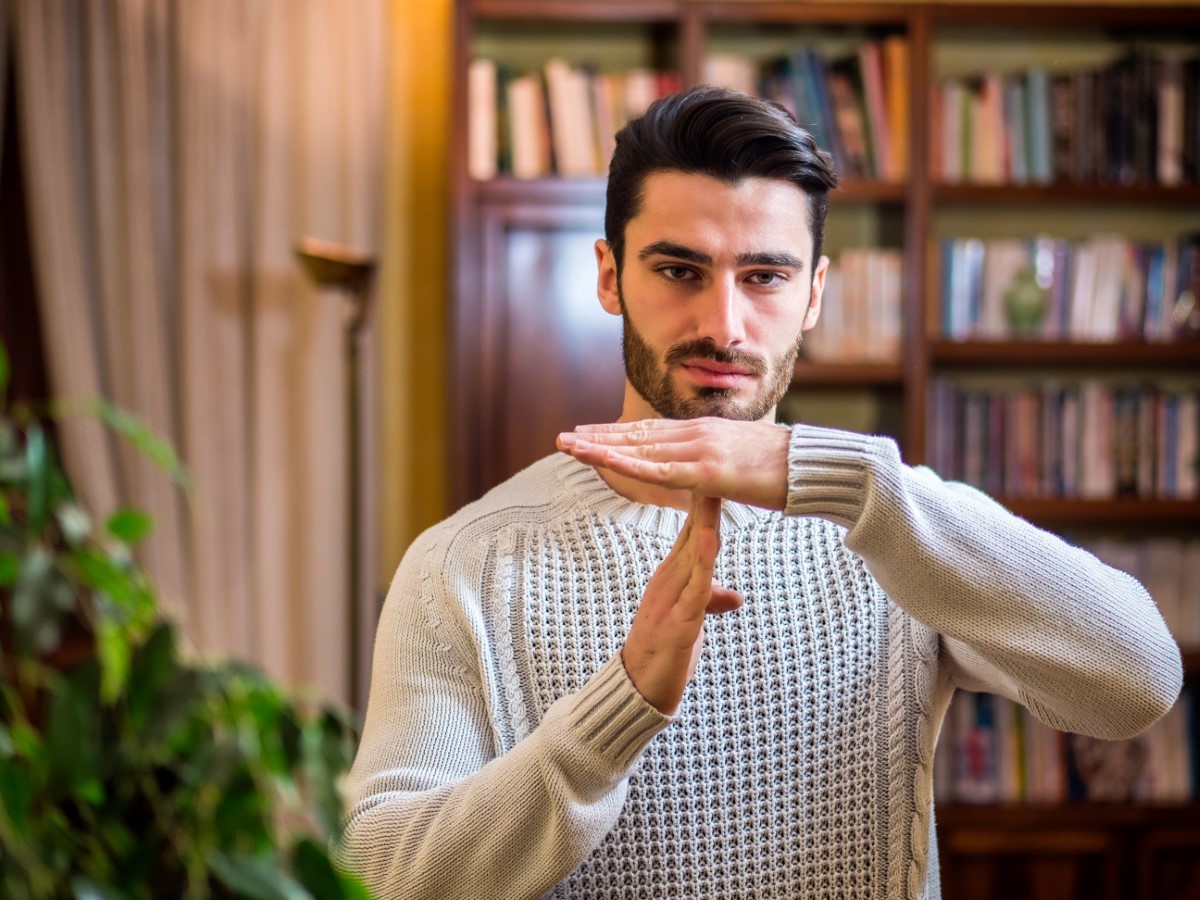 man in library suggesting time out